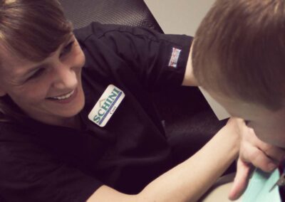 young boy and smiling dental assistant