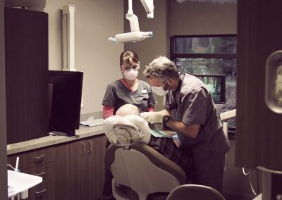 Doctor Schini and assistant working on a patient